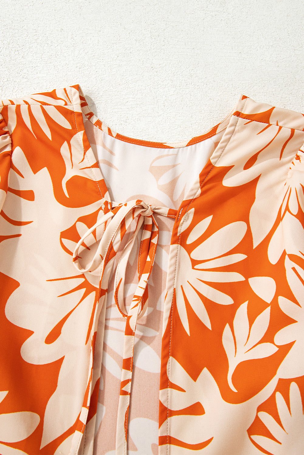 Orange Floral Print Knotted Backless Long Sleeve Blouse